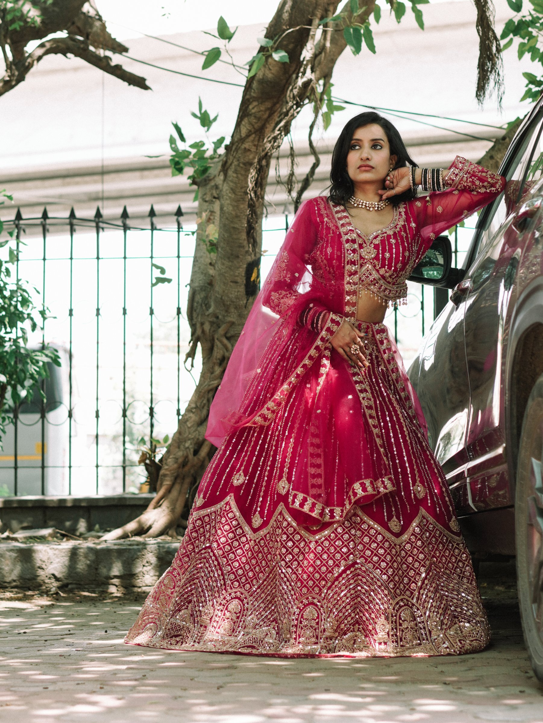 The Fuchsia Radiance Lehenga, a pink embroidered lehenga with a net dupatta, by Label Shivaksh