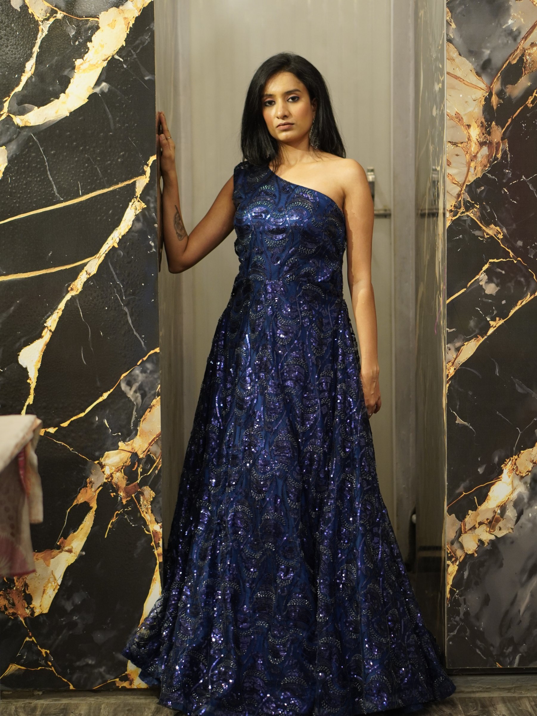 Midnight Élan, a one-shoulder midnight-blue sequin gown by Label Shivaksh